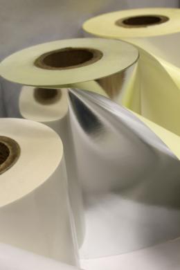 Applying glue to roll materials